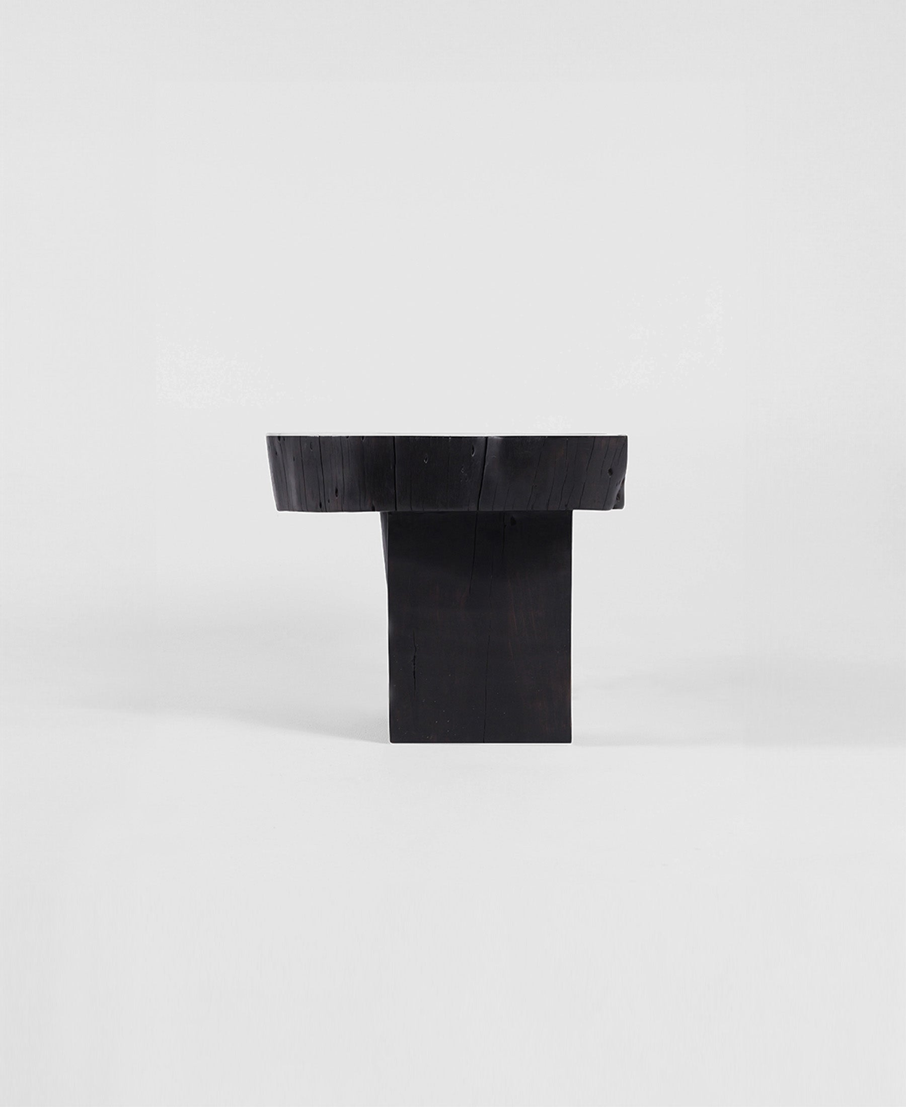 Trunk Seat, three-quarter view, carved timber seat
