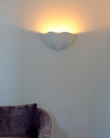 Clam Sconce, lifestyle interior view above sofa