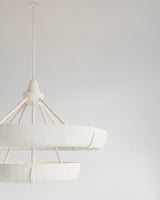 Aura Double Hanging Light, close-up of textured plaster surface