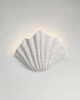 Cove Sconce, light-on view, resin wall sconce