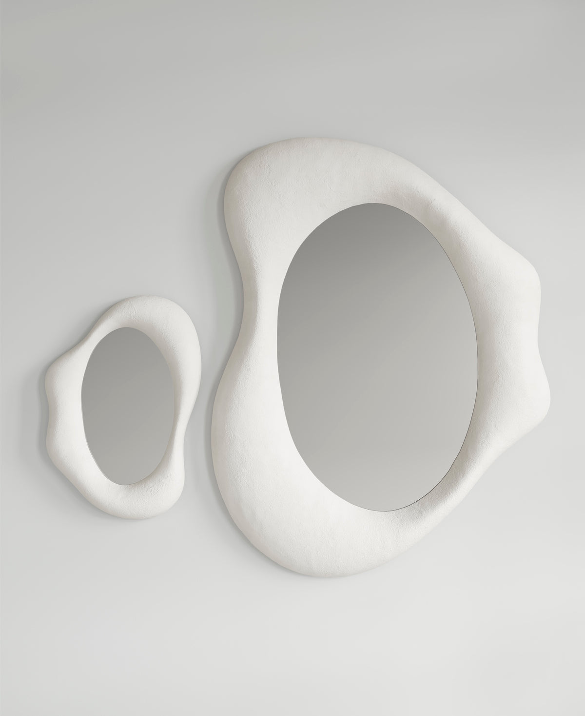Drop Mirror large and small together, front view, sculptural wall mirrors