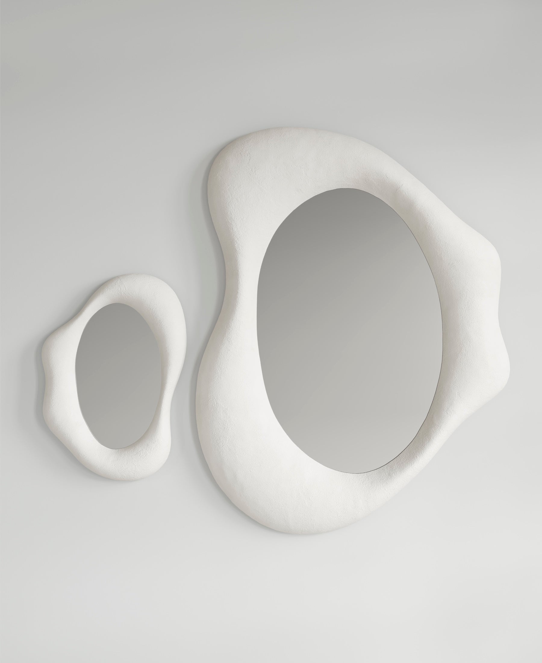 Drop Mirror large and small together, front view, sculptural wall mirrors