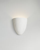 Elce Sconce, light-on view, sculptural resin wall sconce