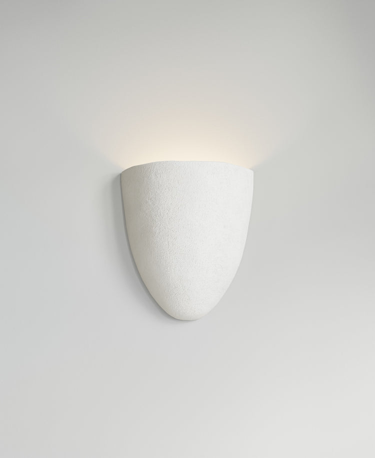 Elce Sconce, light-on view, sculptural resin wall sconce