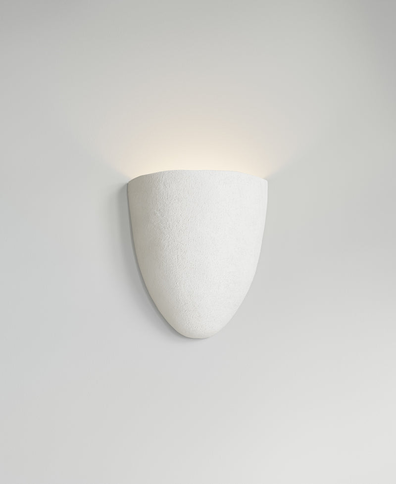 Elce Sconce, light-on view, sculptural resin wall sconce