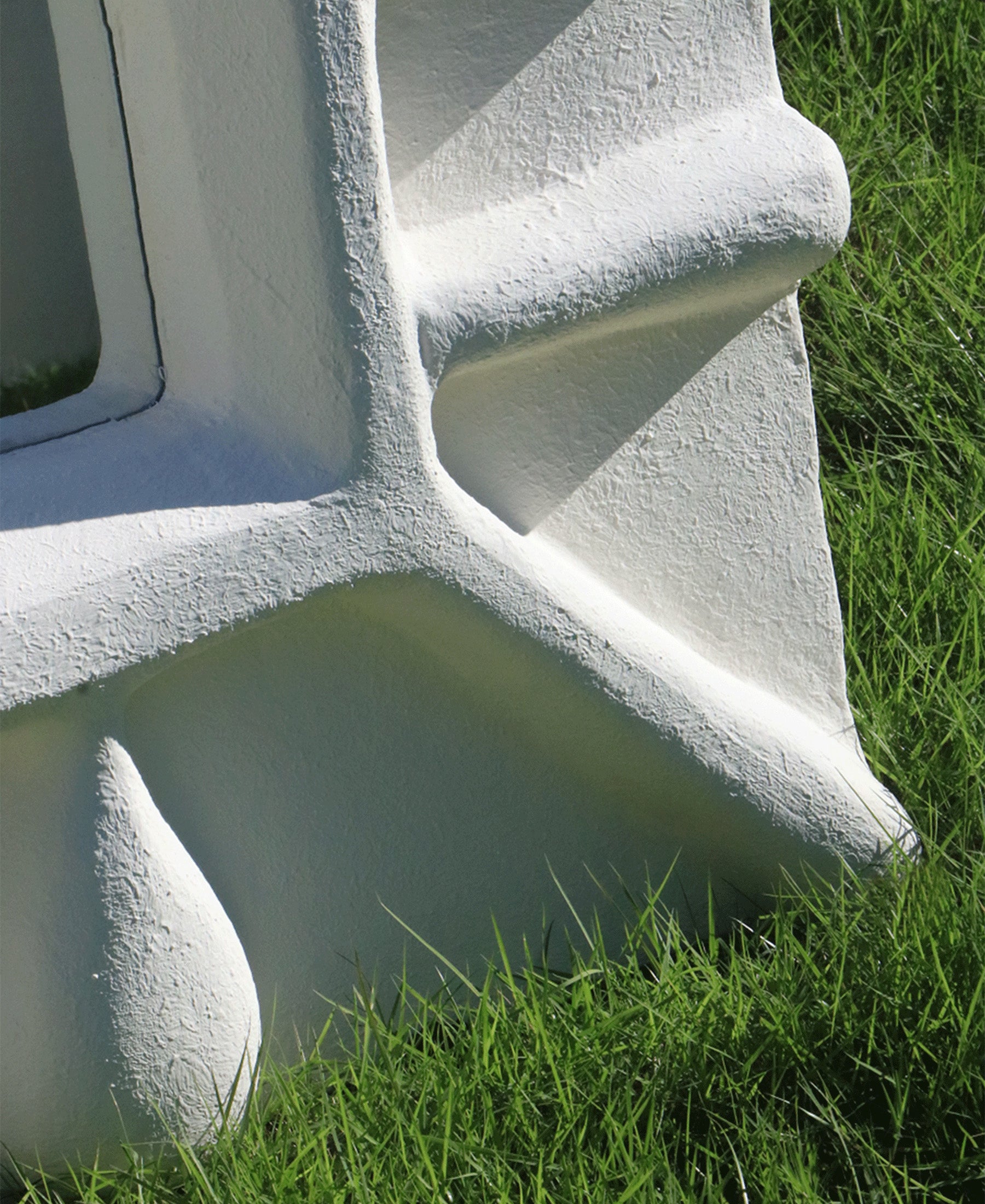 Albini Mirror, angle view three, white sculptural plaster mirror