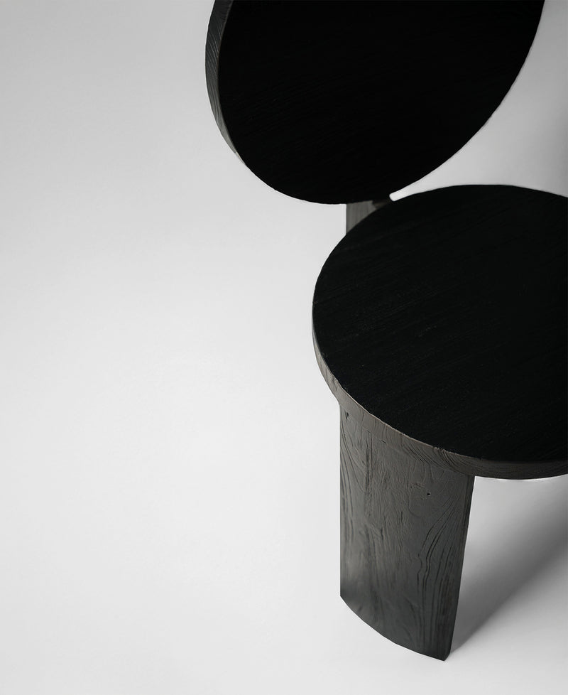 Chair 00, angled view two, black satin teak dining chair