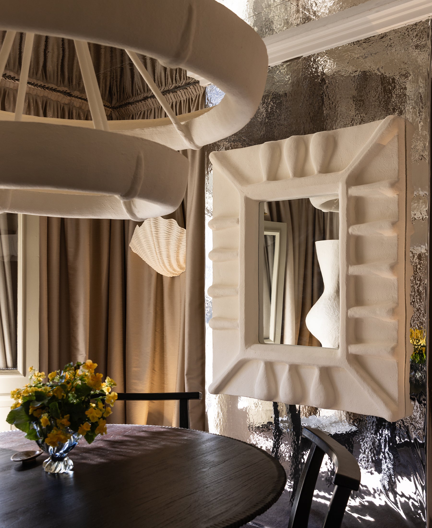 Albini Mirror, lifestyle view in interior, white sculptural plaster mirror
