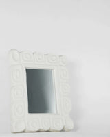 Cocteau Mirror, angled view, carved plaster wall mirror